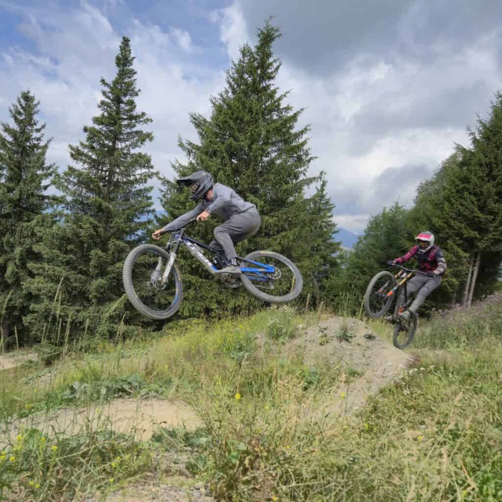 two MTB riders jumping at LESTGETS